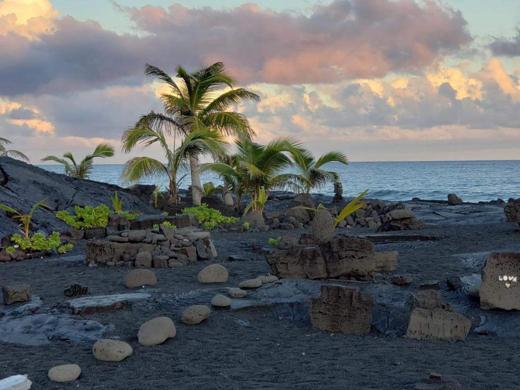 Black sand beach at sunset near the lodge